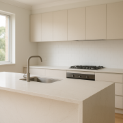 Modern kitchen with engineered stone benchtop and waterfall island edge