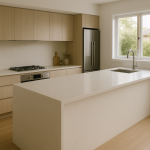 Modern kitchen with light engineered stone benchtop and waterfall island edge