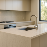 Light Carrara-look engineered stone island benchtop with soft grey veining in a modern Australian kitchen